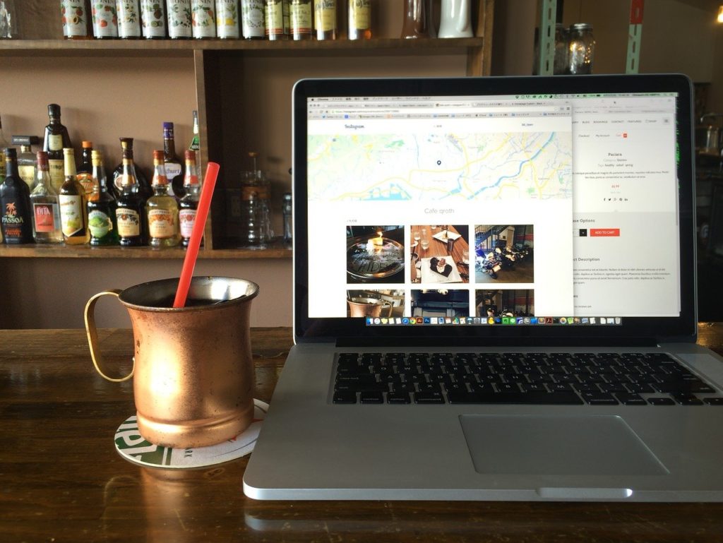 a laptop on a table in a bar